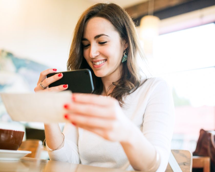 woman depositing a check-mobile deposit