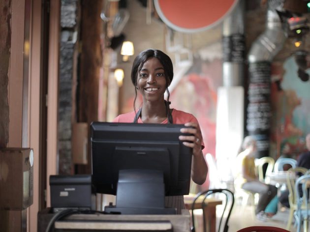 Female cashier smiling