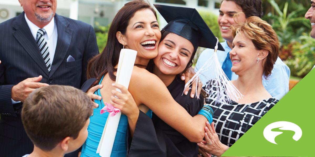 Mother hugging daughter who graduated from college