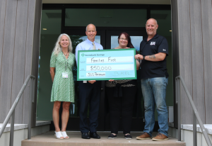 Kennebunk Savings President and CEO Bradford C. Paige and Community Relations and Social Responsibility Manager Liz Torrance present a $50,000 grant to the Families First Capital Campaign for their new Federally Qualified Health Center.