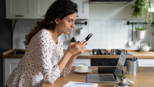 Woman on cell phone at home