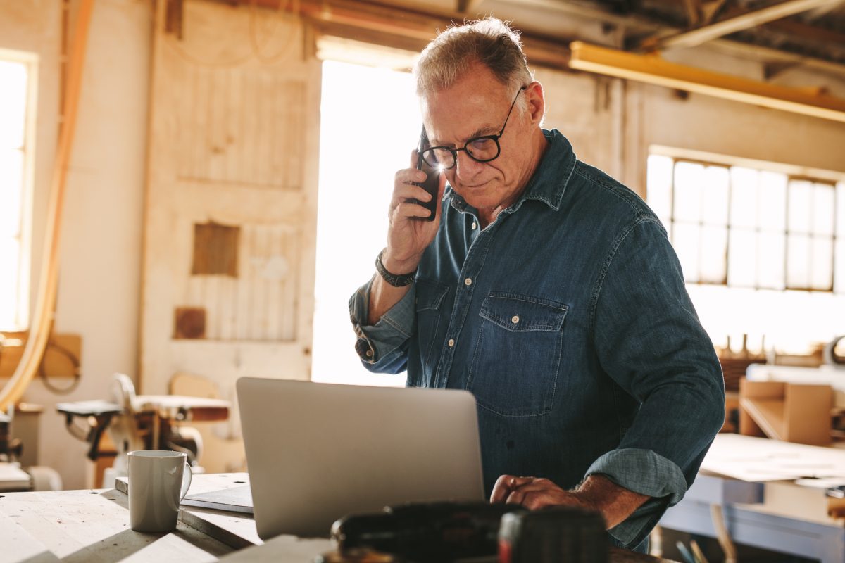 business man on computer in his shop