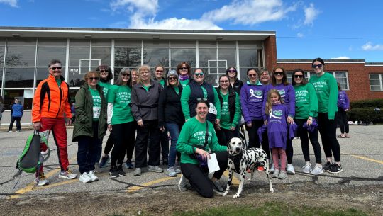 A group of Bank employees pose for a group photo at Mary's Walk.