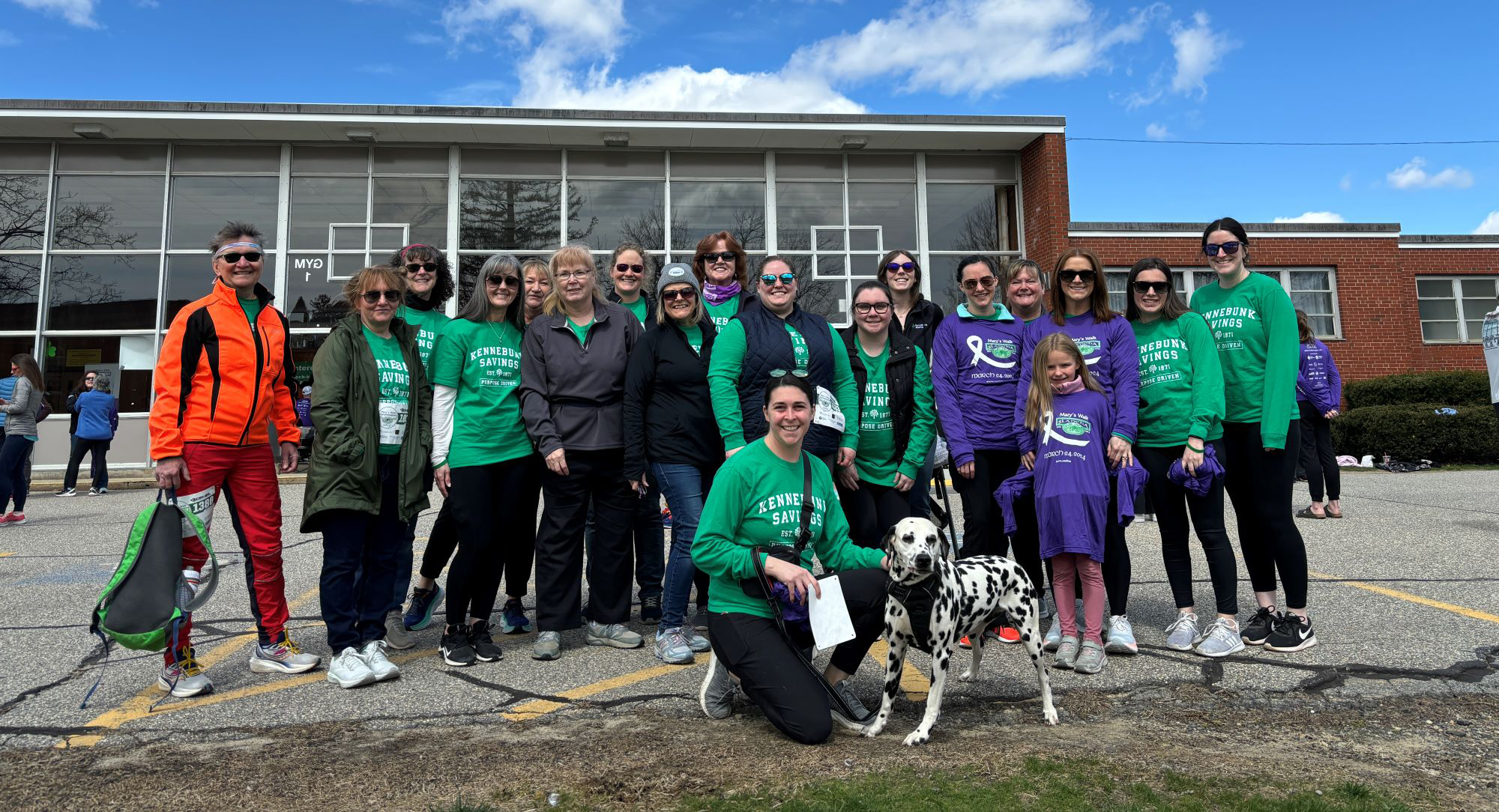 A group of Bank employees pose for a group photo at Mary's Walk.